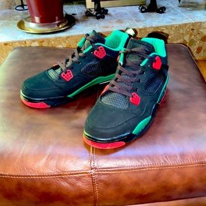 A pair of Air Jordans Retro 4, size 13. colors red, black and green.